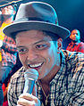 Fedora hats were popular at the beginning of the 2010s, worn here by Bruno Mars in 2011, singer of "Uptown Funk" (the Billboard Hot 100's #1 song of the 2010s).