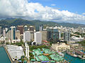 Aerial view of downtown Honolulu with Aloha Tower in the foreground.