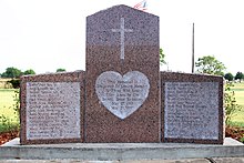 A granite memorial with victims' names