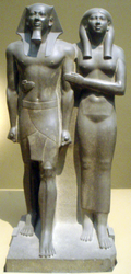 Greywacke statue of Menkaura and Queen Khamerernebty II at the Boston Museum of Fine Arts.