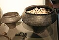 Funerary ceramic vessels and metal brooch