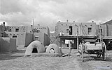 Taos Pueblo showing adobe-ovens