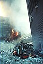 6 WTC on fire during the September 11th attacks, visible behind 7 WTC and its footbridge.