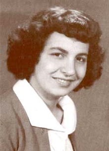 Head and shoulders portrait of woman looking at the camera