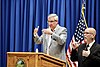 Indiana Governor Eric Holcomb (left) and American Sign Language interpreter