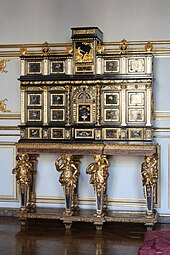 Baroque caryatids of a cabinet; c.1675; ebony, kingwood, marquetry of hard stones, gilt bronze, pewter, glass, tinted mirror and horn; unknown dimensions; Musée des Arts décoratifs, Strasbourg, France[126]