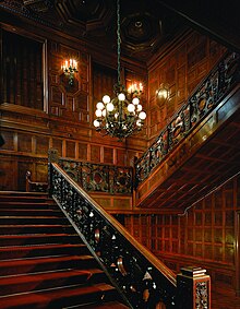 A view of the house's grand staircase, which is made of imported Scottish oak
