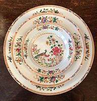 A set of medallion, rice dish, and dinner plate of the Double Peacock Dinner Service, famille rose