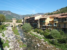 A view of Sospel, with the River Bévéra flowing beneath the old bridge