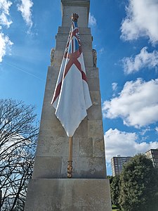 Flag carved from stone and painted as the White Ensign (a red cross on a white background with the Union Flag in the top left quadrant)