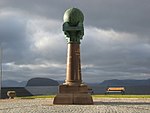 Struve Geodetic Arc pillar in Hammerfest. There is a globe on the top of the pillar.