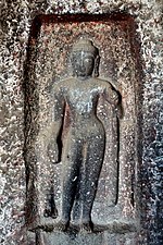 Standing Buddha (a later addition).[34]