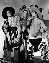 Publicity photo of Abbott and Costello, dressed as Latin musicians, with Miranda
