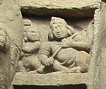 sculpture of a Kinnara playing an alapini vina