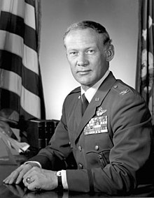 Aldrin in an air force colonel's uniform, with five rows of ribbons and astronaut wings.