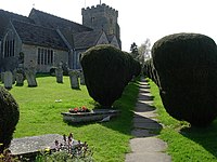 The path to St Peter's Church in Henfield is flanked by topiary