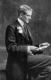 A portrait of Herbert Vivian wearing a suit with white buttonhole, in 1904