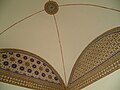 Painted decoration around a vaulted ceiling
