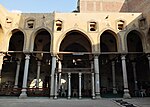 The courtyard of the mosque (looking towards the mihrab). Carved stucco is visible around the arches.