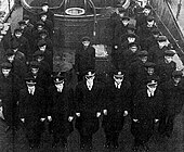 Officers and enlisted men of PC-1264 at its decommissioning.