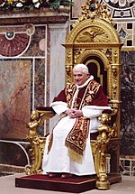 Pope Benedict XVI wearing the papal choir dress: papal mozzetta, rochet, white cassock, pectoral cross and a red embroided stole