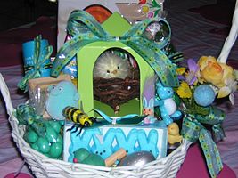 Marshmallow rabbits, candy eggs and other treats in an Easter basket
