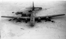 Overhead photo of a large, wrecked plane on ice