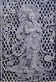 Relief of a Bodhisattva playing a flute on the temple's 8th century Octagonal Lantern.