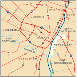 Map shows Albany on the west bank of the Hudson, surrounded by the towns of Colonie, Guilderland, and Bethlehem. Roads are also shown. Interstates 90, 87, and 787 pass through the city boundaries.