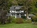 The Satterlee House (1906) at 4866 Beach Drive SW in West Seattle, one of the grander examples of the Foursquare or Box style[68]