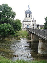 The church and the bridge over the Aube river in Dienville