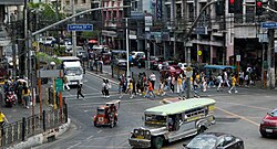 Pedestrians crossing Nicanor Reyes Street in Sampaloc, Manila