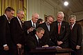 President Bush signs USA PATRIOT Act.