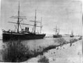 Cargo ships make their way through the Suez Canal, c. 1880