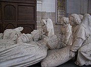 The portraits of the deceased, Francis and Margaret, on the tomb, their heads supported on pillows by angels
