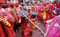 In the Braj region of North India, women have the option to playfully hit men who save themselves with shields; for the day, men are culturally expected to accept whatever women dish out to them. This ritual is called Lath Mar Holi.[99]