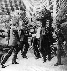 Illustration of Leon Czolgosz shooting William McKinley, with a gun concealed beneath a handkerchief