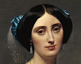Detail of de Broglie's head and neck, showing her pearl earrings and the delicate marabou feathers in her hair