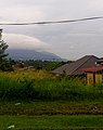 The Titiwangsa Mountains near Rembau, looking south. Mount Tampin is recognizable as the light grey triangular mountain rising behind Mount Datuk (with the cloudy peak).