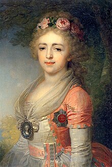 Young woman wearing a white dress with a light blue belt and coat. A miniature of a woman hangs in her neck, and she's wearing the badge of the Order of Saint Catherine on her chest. Her long and curly hair is powdered with a wreath of roses in it.
