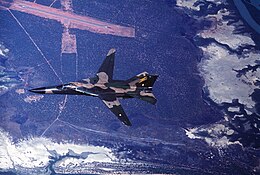 Overhead view of F-111C in flight