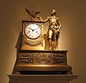 A ca. 1810–1815 French Empire mantel clock, portraying George Washington. In the drapery swag under the dial can be read the famous quote by Henry Lee.