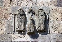 High-relief depiction commemorating the patronage of the Zakaryan brothers (Zakare II Zakarian and Ivane), on the upper east exterior wall of S. Astvatatsin Church, Haghartsin Monastery.