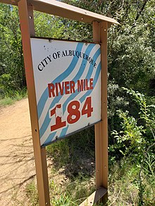 A sign that says City of Albuquerque River Mile 184.