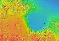 MOLA colorized topographic map showing Isidis Planitia (right) and the adjacent low-relief shield volcano Syrtis Major Planum (left).