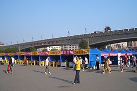 Welcome booths set up by Xi'an's university and colleges for their new students on the plaza in front of Xi'an railway station