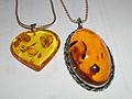 Amber pendants. The oval cabochon pendant is 52 × 32 mm (2 × 1.3 in).