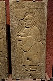 Carved reliefs on stone tomb doors showing a man dressed in Hanfu and holding a broom, Chinese Eastern Han dynasty (25–220 AD), from Lanjia Yard, Pi County, Sichuan province, Sichuan Provincial Museum of Chengdu, China