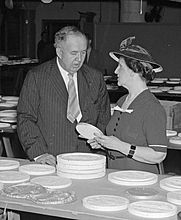 Edward Bruce (left) and Nellie Tayloe Ross of the United States Mint inspect candidates for the design of the new Jefferson nickel, a competition conducted by the Section (1938)
