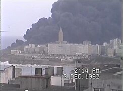 Oil tanker Aegean Sea burning behind the Tower of Hercules in 1992
